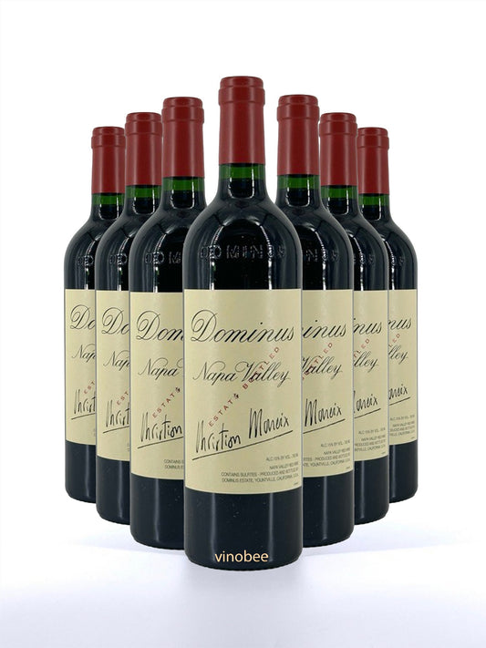 Row of Dominus Napa Valley wine bottles on a white background